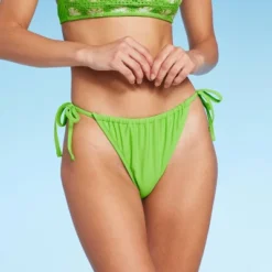Women's Low-Rise Side-Tie Cheeky Bikini Bottom - Wild Fable™ 17 Women's Low-Rise Side-Tie Cheeky Bikini Bottom - Wild Fable™ -Wild Fable Store GUEST fb45f3d8 0545 4021 95ce 6cc80b70ceec